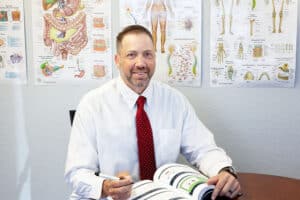 Michael Durham of Age Well NP sitting at table